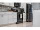 Modern kitchen showcasing stainless steel appliances and stylish backsplash at 3244 55Th Ave N, St Petersburg, FL 33714