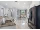 Open kitchen features granite countertops, stainless steel appliances, a bar area, and marble flooring at 3244 55Th Ave N, St Petersburg, FL 33714