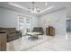 Inviting living room featuring marble floors, recessed lighting, ceiling fan, and access to the lanai at 3244 55Th Ave N, St Petersburg, FL 33714