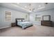 Bright main bedroom featuring a ceiling fan and a large walk-in closet at 3244 55Th Ave N, St Petersburg, FL 33714