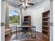 Office space with hardwood flooring, a large window, and ample storage at 3244 55Th Ave N, St Petersburg, FL 33714