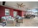 Inviting covered patio with comfortable seating, dining area, and fans for year-round enjoyment at 3244 55Th Ave N, St Petersburg, FL 33714