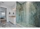 Beautiful walk-in shower features attractive tile work, glass enclosure, and river rock accents at 3244 55Th Ave N, St Petersburg, FL 33714