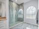 Walk-in shower features attractive tile work, a glass enclosure, and river rock accents at 3244 55Th Ave N, St Petersburg, FL 33714
