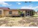 Backyard view showcasing a screened porch and ample space for gardening at 4549 Tippecanoe Trl # 20, Sarasota, FL 34233