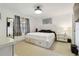 Bright bedroom featuring a full sized bed with storage drawers and neutral decor at 4549 Tippecanoe Trl # 20, Sarasota, FL 34233