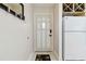 Foyer with guitar-themed rug and decor, leading into a bright and inviting space at 4549 Tippecanoe Trl # 20, Sarasota, FL 34233