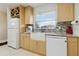 Updated kitchen featuring stainless appliances, a farmhouse sink, and stylish backsplash at 4549 Tippecanoe Trl # 20, Sarasota, FL 34233