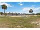 Picturesque community pond surrounded by lush grass and well-maintained landscaping at 4549 Tippecanoe Trl # 20, Sarasota, FL 34233