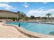 Community pool with clear blue water, poolside furniture, and well-maintained surrounding area at 4549 Tippecanoe Trl # 20, Sarasota, FL 34233
