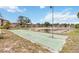Community shuffleboard courts surrounded by a serene pond and lush greenery at 4549 Tippecanoe Trl # 20, Sarasota, FL 34233