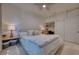 Cozy bedroom with a ceiling fan, a large window and neutral tones, creating a peaceful retreat at 6504 Virginia Xing, University Park, FL 34201
