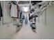 Spacious walk-in closet with organized shelving, providing ample storage for clothes and accessories at 6504 Virginia Xing, University Park, FL 34201