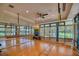 Bright dance studio with wood floors, mirrors, and fitness equipment, great for workouts at 6504 Virginia Xing, University Park, FL 34201