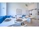 Bright dining room featuring modern white dining table, bench seating, and large windows at 6504 Virginia Xing, University Park, FL 34201