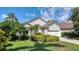 Well-kept single-Gathering home featuring lush greenery, a two-car garage, and a neatly trimmed lawn at 6504 Virginia Xing, University Park, FL 34201
