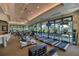 Bright, spacious gym featuring modern treadmills, bikes, weights, and mounted TVs at 6504 Virginia Xing, University Park, FL 34201