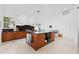 Modern kitchen with a central island, stainless steel appliances, and open layout ideal for cooking and socializing at 6504 Virginia Xing, University Park, FL 34201