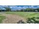 Community lawn bowling area on a sunny day with shaded viewing area at 6504 Virginia Xing, University Park, FL 34201