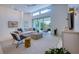 The bright living room features modern furnishings and a large sliding glass door at 6504 Virginia Xing, University Park, FL 34201