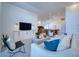 A comfortable living room with a sofa, chairs, and an open layout into the kitchen at 6504 Virginia Xing, University Park, FL 34201