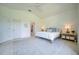 Spacious main bedroom featuring stylish furniture, large windows, and tile flooring at 6504 Virginia Xing, University Park, FL 34201