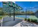 Shaded lounge area next to pristine blue and green community tennis courts at 6504 Virginia Xing, University Park, FL 34201
