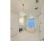 Bright bathroom features a modern tub, glass shower and elegant chandelier at 4309 W Beachway Dr, Tampa, FL 33609