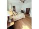 Bright bedroom boasts a decorative bed, dark wood floors, and ample natural light from the window at 4309 W Beachway Dr, Tampa, FL 33609