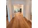 Elegant hallway with hardwood floors leading to a bright and inviting living area at 4309 W Beachway Dr, Tampa, FL 33609