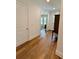 Entryway hallway featuring hardwood floors, white walls, and elegant trim at 4309 W Beachway Dr, Tampa, FL 33609