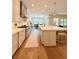 Bright kitchen featuring white cabinets, stainless steel appliances, and a spacious island with seating at 4309 W Beachway Dr, Tampa, FL 33609