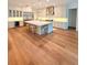 Spacious kitchen featuring an island, stainless steel appliances, and hardwood floors at 4309 W Beachway Dr, Tampa, FL 33609
