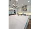 Elegant kitchen showcasing white cabinetry, stainless steel hood, and a large island with a bright countertop at 4309 W Beachway Dr, Tampa, FL 33609