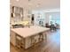 Open kitchen with stainless steel appliances, bright lighting, and a central island with bar stool seating at 4309 W Beachway Dr, Tampa, FL 33609