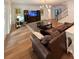 Bright living room featuring hardwood floors, comfortable seating, and a staircase leading to the second floor at 4309 W Beachway Dr, Tampa, FL 33609