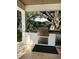 Built-in outdoor kitchen with stainless steel grill, sink, and storage for entertainment at 4309 W Beachway Dr, Tampa, FL 33609