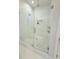 This luxury bathroom includes a spacious glass shower with a rainfall shower head at 4309 W Beachway Dr, Tampa, FL 33609