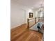 Hardwood floors lead to the second level with wood and white railing at 4309 W Beachway Dr, Tampa, FL 33609