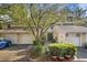 Charming townhome with well-manicured landscaping and attached garage, perfect for suburban living at 11239 Cedar Hollow Ln, Tampa, FL 33618