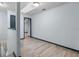 Open hallway with wood-look floors and modern trim details at 11239 Cedar Hollow Ln, Tampa, FL 33618
