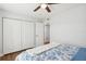 Bedroom featuring a ceiling fan, closet and view to the adjoining room at 265 Seahorse Se Dr # B, St Petersburg, FL 33705