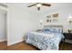 Bright bedroom with a wood accent wall, ceiling fan and lots of natural light at 265 Seahorse Se Dr # B, St Petersburg, FL 33705