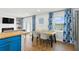Open floor plan featuring the kitchen, dining room and living room with fireplace at 265 Seahorse Se Dr # B, St Petersburg, FL 33705