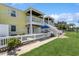 This sunny exterior features a well-maintained lawn and inviting patios with direct access to outdoor spaces at 265 Seahorse Se Dr # B, St Petersburg, FL 33705
