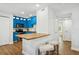 Kitchen featuring bar stool seating and bright blue cabinetry at 265 Seahorse Se Dr # B, St Petersburg, FL 33705