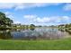 The property boasts serene lake views, surrounded by lush green lawns and community residences at 265 Seahorse Se Dr # B, St Petersburg, FL 33705