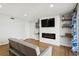 Living room featuring an electric fireplace, tv and contemporary design at 265 Seahorse Se Dr # B, St Petersburg, FL 33705