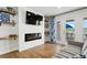 Inviting living room with modern fireplace and water views at 265 Seahorse Se Dr # B, St Petersburg, FL 33705