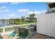 This is a lovely patio sitting area with lush landscaping and a lake view at 265 Seahorse Se Dr # B, St Petersburg, FL 33705
